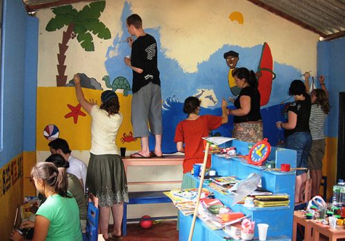 A group of volunteers painting the school in Sri Lanka