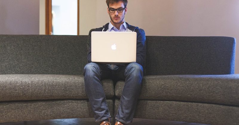 Deaf employee working on a laptop