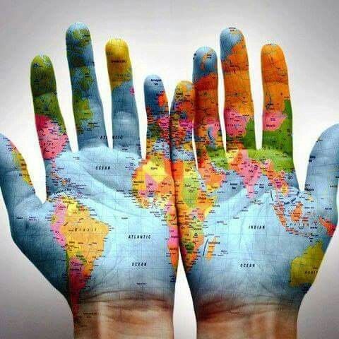 A picture of someone showing their hands palms up and painted with the globe. For us this represents the global deaf sign language community