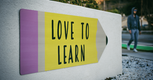 deaf students - Love to Learn written on a picture of a pencil pointing to a student