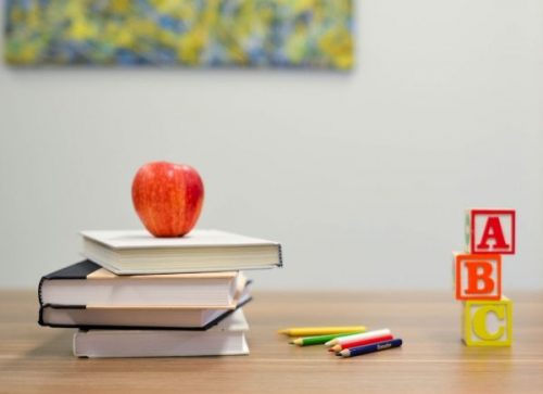 deaf students desk with books and apple