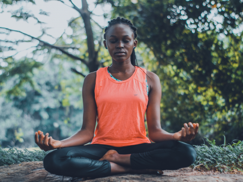 woman meditating: new year's resolutions for deaf people