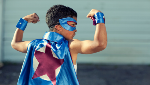 Young deaf boy in a superhero costume