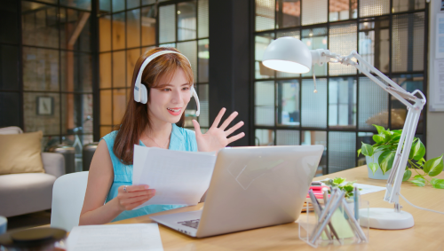 an asian interpreter discussing a report on a zoom call