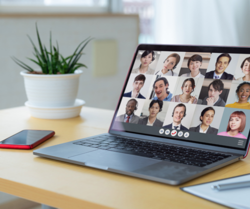 Deaf people using remote working video conference. Laptop on a desk with a call running