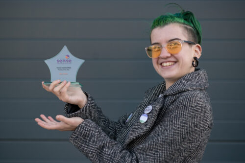 Max holding glass star Sense award.